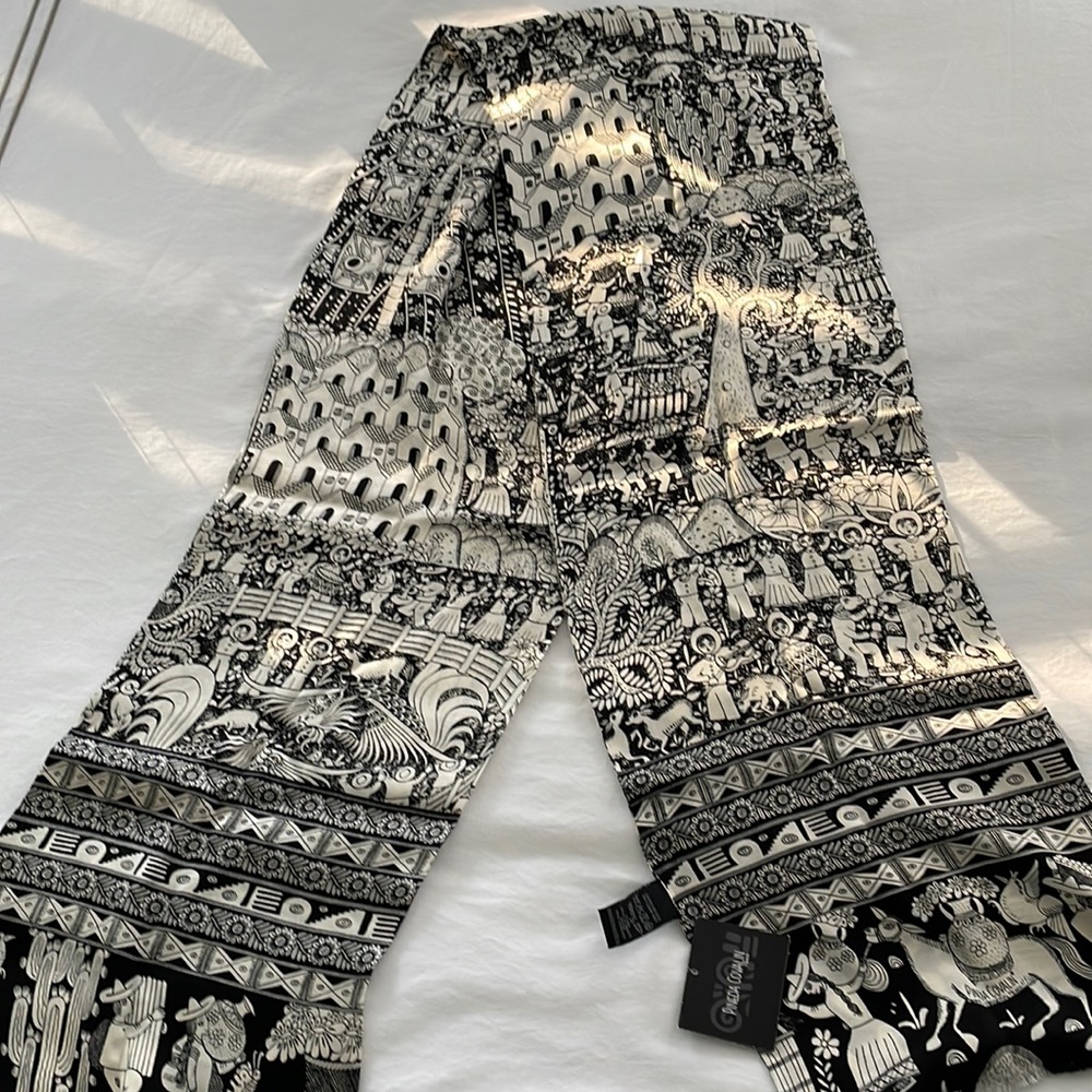Beautiful print silk scarf. Brand new with tags.  68” long by 10” wide.